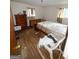 A bedroom featuring hardwood floors and a double bed, awaiting a makeover at 5637 Sturbridge Way, South Fulton, GA 30349