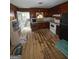 Classic kitchen featuring white appliances, wood paneling, and an adjacent doorway to a screened porch at 5637 Sturbridge Way, South Fulton, GA 30349