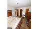 Main bedroom featuring wood floors, multiple closets, and a private access to the outdoor space at 5637 Sturbridge Way, South Fulton, GA 30349