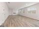 Spacious living room featuring hardwood floors, a fireplace, and ample natural light from large windows at 8501 Polston Pl # 143, Douglasville, GA 30134