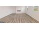 Contemporary living room with wood-look floors, a modern fireplace, and bright windows at 8501 Polston Pl # 143, Douglasville, GA 30134