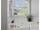 Bright bathtub featuring a large window and serene decor for a relaxing bathroom experience at 1010 Elaine Ct, Mcdonough, GA 30252