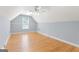 Spacious room with sloped ceilings, hardwood floors, and a centered window at 1010 Elaine Ct, Mcdonough, GA 30252