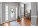 Inviting foyer featuring hardwood floors, a decorative door, and views into the dining area at 1010 Elaine Ct, Mcdonough, GA 30252