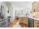 Kitchen features stainless steel appliances, a tiled backsplash, and bright, natural light at 1010 Elaine Ct, Mcdonough, GA 30252
