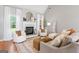 Cozy living room with fireplace, comfortable seating, and neutral decor at 1010 Elaine Ct, Mcdonough, GA 30252