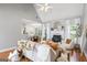 Bright, open living room features a fireplace, vaulted ceiling, and hardwood flooring at 1010 Elaine Ct, Mcdonough, GA 30252