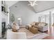 Open-concept living room with vaulted ceilings, neutral colors, and comfortable furniture at 1010 Elaine Ct, Mcdonough, GA 30252