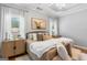 Beautiful primary bedroom with a king bed, natural light, and hardwood flooring at 1010 Elaine Ct, Mcdonough, GA 30252