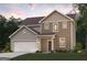 New construction home featuring two-story construction, a front-facing garage, and neutral color palette at 8502 Polston Place # 144, Douglasville, GA 30134