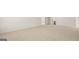 Large basement area with neutral carpet, white walls, and natural light from windows at 1949 Van Allen Ct # 4, Dacula, GA 30019