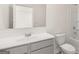 Bathroom featuring modern gray vanity with white countertops, large mirror, and a shower-tub combo at 1949 Van Allen Ct # 4, Dacula, GA 30019