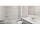 This bathroom has a tub, shower, toilet, and a vanity with sink and hardware at 1949 Van Allen Ct # 4, Dacula, GA 30019