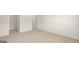 This bedroom features neutral carpet, white walls, baseboards and trim, plus a closet at 1949 Van Allen Ct # 4, Dacula, GA 30019