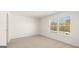 Bedroom with neutral carpet flooring, bright walls, and natural light at 1949 Van Allen Ct # 4, Dacula, GA 30019