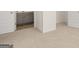 Spacious bedroom featuring neutral carpet, white walls, and access to a bathroom and closet at 1949 Van Allen Ct # 4, Dacula, GA 30019