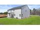 New two-story home features light siding and a spacious lawn at 1949 Van Allen Ct # 4, Dacula, GA 30019
