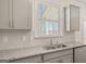 New kitchen features granite countertops, stainless steel appliances and herringbone backsplash at 1949 Van Allen Ct # 4, Dacula, GA 30019