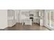 Spacious kitchen with gray cabinets, granite countertops, stainless steel appliances, and hardwood floors at 1949 Van Allen Ct # 4, Dacula, GA 30019