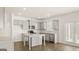 Bright kitchen featuring gray cabinets, granite countertops, a center island and stainless steel appliances at 1949 Van Allen Ct # 4, Dacula, GA 30019