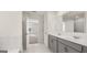 Bright main bathroom with double vanity and open concept design at 1949 Van Allen Ct # 4, Dacula, GA 30019