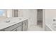 Main bathroom with double vanity, separate shower, bathtub, and walk-in closet at 1949 Van Allen Ct # 4, Dacula, GA 30019