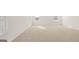 Main bedroom features fresh paint, new carpet, and two large windows at 1949 Van Allen Ct # 4, Dacula, GA 30019