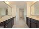 A dual sink bathroom vanity with marble countertop at 321 Champions Dr, Fairburn, GA 30213