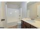 Well-maintained bathroom featuring a shower-tub combo and a modern vanity at 321 Champions Dr, Fairburn, GA 30213