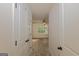 View into a bedroom with a ceiling fan and a large window overlooking the backyard at 321 Champions Dr, Fairburn, GA 30213