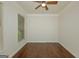 Empty bedroom with hardwood floors, natural light, and neutral paint at 321 Champions Dr, Fairburn, GA 30213