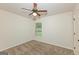 Relaxing bedroom with a ceiling fan, large window and neutral walls at 321 Champions Dr, Fairburn, GA 30213