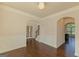 Formal dining room featuring wainscoting, hardwood floors and a chandelier at 321 Champions Dr, Fairburn, GA 30213