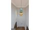 Foyer featuring a hardwood floor and a hanging pendant lamp with yellow glass shade at 321 Champions Dr, Fairburn, GA 30213