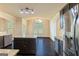 Kitchen with stainless steel appliances, granite countertops, and dark wood cabinets at 321 Champions Dr, Fairburn, GA 30213