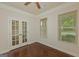 Office space featuring hardwood floors, neutral walls and window with wood blinds at 321 Champions Dr, Fairburn, GA 30213