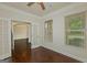 Bright office with dark hardwood floors, white trim, and large windows with natural light at 321 Champions Dr, Fairburn, GA 30213