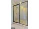 Modern glass enclosed shower with tile walls and shower head at 321 Champions Dr, Fairburn, GA 30213