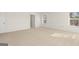 Spacious main bedroom with plush carpeting, large windows, and ample natural light at 1950 Van Allen Ct, Dacula, GA 30019