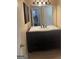 Stylish bathroom with a dark vanity, a large mirror, and updated fixtures and lighting at 6050 Great Oaks Dr, Lithonia, GA 30058