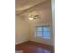 Bright bedroom with ceiling fan, natural light, and hardwood floors at 6050 Great Oaks Dr, Lithonia, GA 30058
