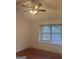 Bedroom with ceiling fan, natural light, and hardwood floors at 6050 Great Oaks Dr, Lithonia, GA 30058