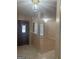 Bright entryway featuring tile flooring, decorative lighting, and an open view to the living area at 6050 Great Oaks Dr, Lithonia, GA 30058