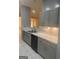 Modern kitchen featuring gray cabinets, white countertops, stainless steel sink, and ample storage space at 6050 Great Oaks Dr, Lithonia, GA 30058