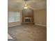 Spacious living room with brick fireplace and hardwood floors at 6050 Great Oaks Dr, Lithonia, GA 30058