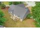 Backyard featuring a covered patio with seating, perfect for outdoor gatherings and relaxation at 556 Walton Dr, Social Circle, GA 30025