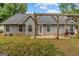 View of a backyard featuring an open patio with grill and pergola at 556 Walton Dr, Social Circle, GA 30025