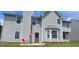 A backyard shows the rear of the house, with a patio area at 1762 Wood Stork Drive, Hampton, GA 30228