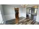 Elegant dining room with wood flooring, neutral paint, and chandelier at 1762 Wood Stork Drive, Hampton, GA 30228