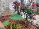 Landscaping surrounding a home with various bushes and other foliage in the front yard at 1762 Wood Stork Drive, Hampton, GA 30228